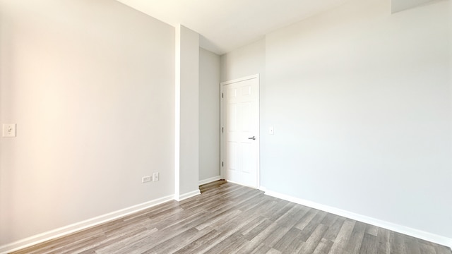 spare room featuring light wood-type flooring