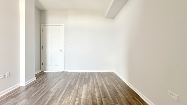 spare room with hardwood / wood-style floors