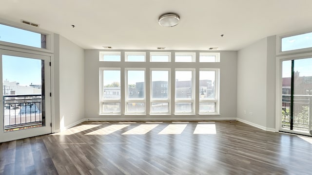 unfurnished room with hardwood / wood-style flooring