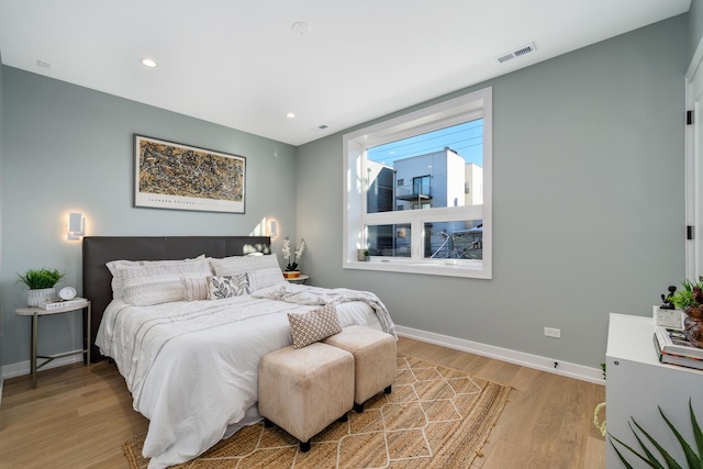 bedroom with light hardwood / wood-style flooring