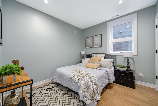 bedroom with light hardwood / wood-style flooring