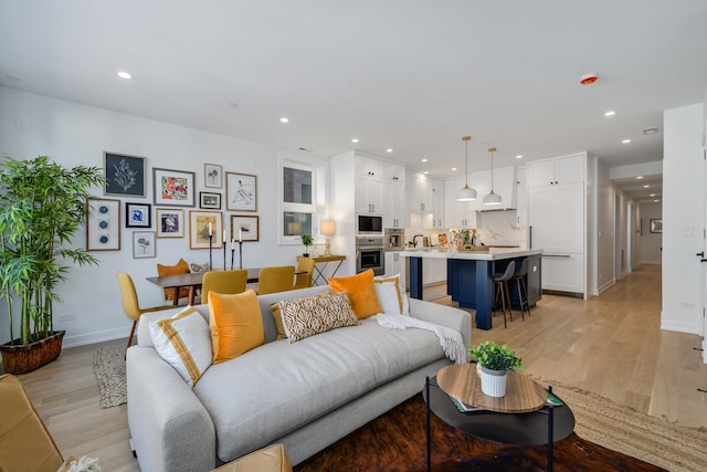 living room with light hardwood / wood-style flooring