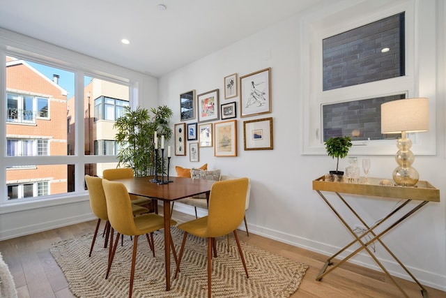 dining room featuring hardwood / wood-style flooring and a wealth of natural light