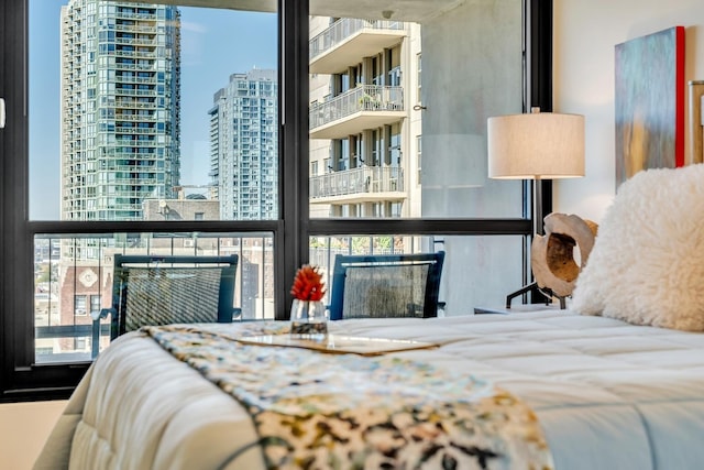 bedroom with a view of city and a fireplace