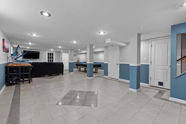 living room featuring light tile patterned flooring and pool table