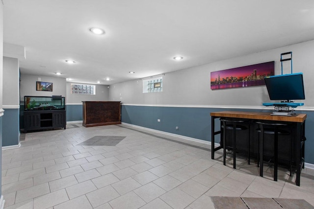 interior space featuring light tile patterned floors and wooden counters