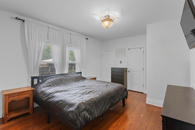 bedroom featuring dark wood-type flooring