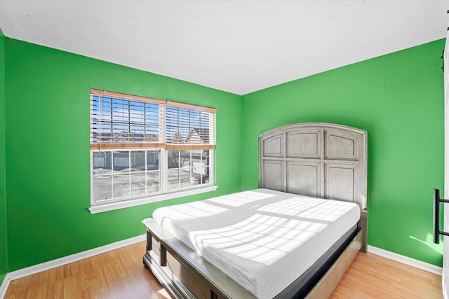 bedroom with light hardwood / wood-style flooring