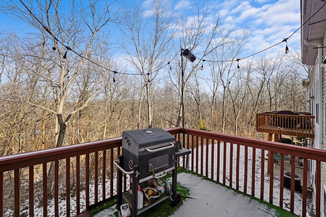 deck with central AC unit and grilling area