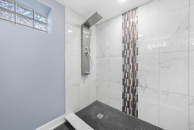 bathroom with tiled shower