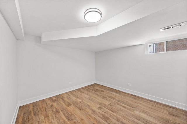 basement featuring light hardwood / wood-style floors