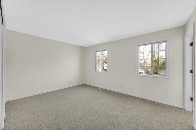 empty room with light colored carpet