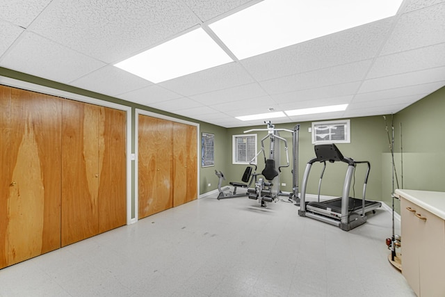 workout room featuring a paneled ceiling