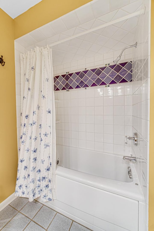 bathroom with tile patterned flooring and shower / bath combo with shower curtain