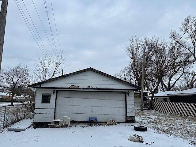 view of snow covered garage