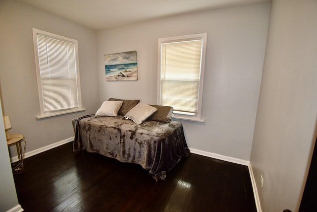 bedroom featuring dark hardwood / wood-style flooring