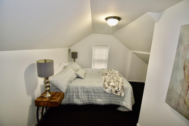 bedroom with lofted ceiling