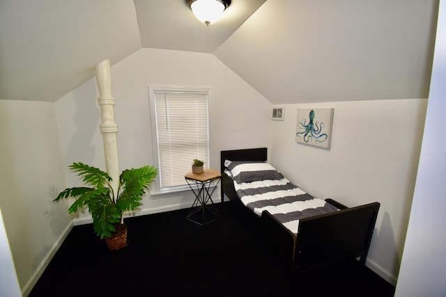 carpeted bedroom featuring lofted ceiling