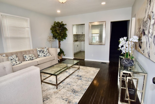 living room featuring dark hardwood / wood-style floors