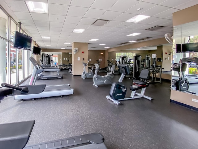 exercise room featuring a paneled ceiling