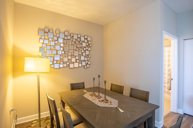 dining space featuring hardwood / wood-style flooring