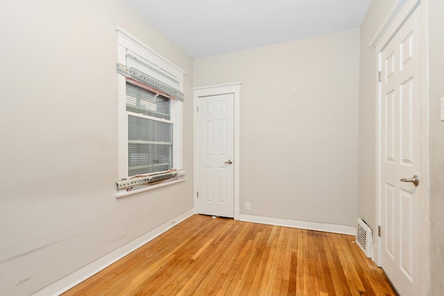 spare room featuring hardwood / wood-style flooring