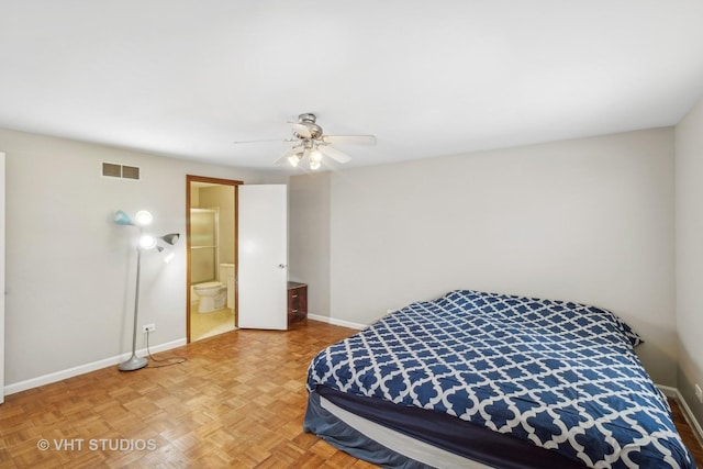 bedroom featuring ensuite bathroom, parquet flooring, and ceiling fan