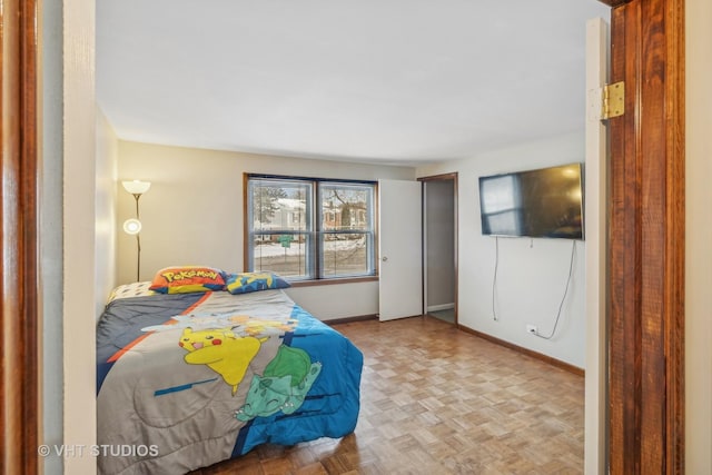 bedroom featuring light parquet flooring