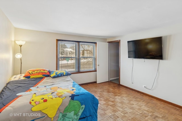 bedroom with light parquet floors