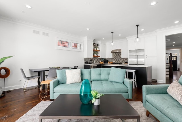 living room featuring crown molding and dark wood-type flooring