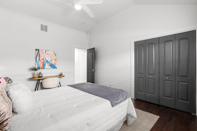 bedroom featuring high vaulted ceiling, ceiling fan, a closet, and dark hardwood / wood-style flooring