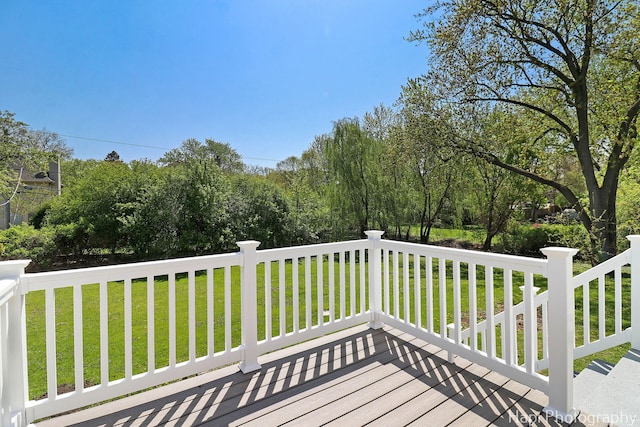 wooden deck with a yard