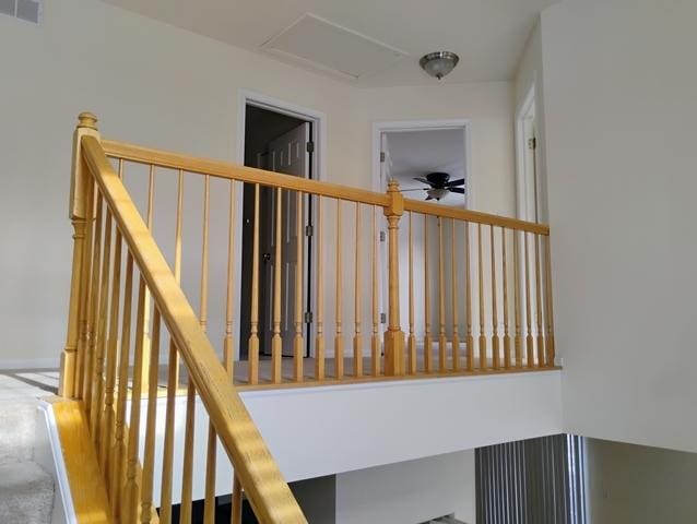 stairway with ceiling fan