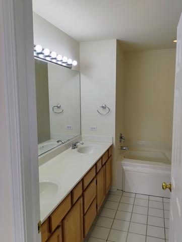 bathroom with vanity and tile patterned floors