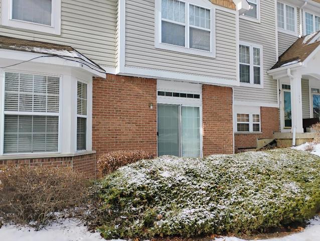 view of snow covered property entrance