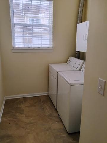 washroom featuring washer and clothes dryer