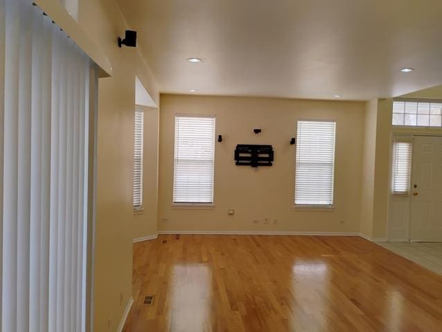 foyer entrance with light wood-type flooring