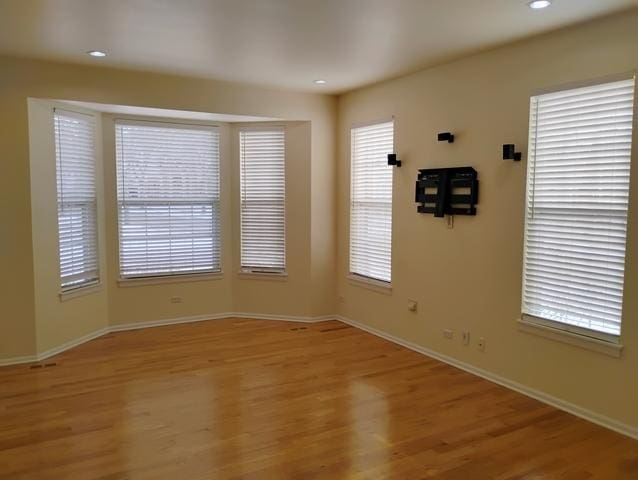 unfurnished room featuring light hardwood / wood-style flooring