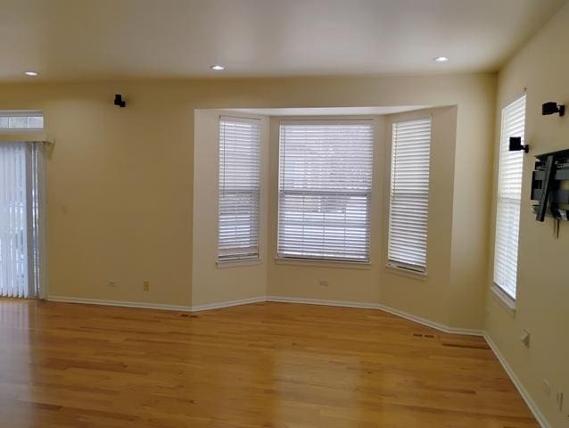 spare room featuring light hardwood / wood-style flooring