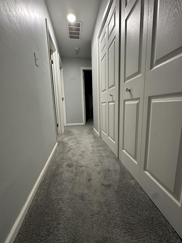 hallway with carpet