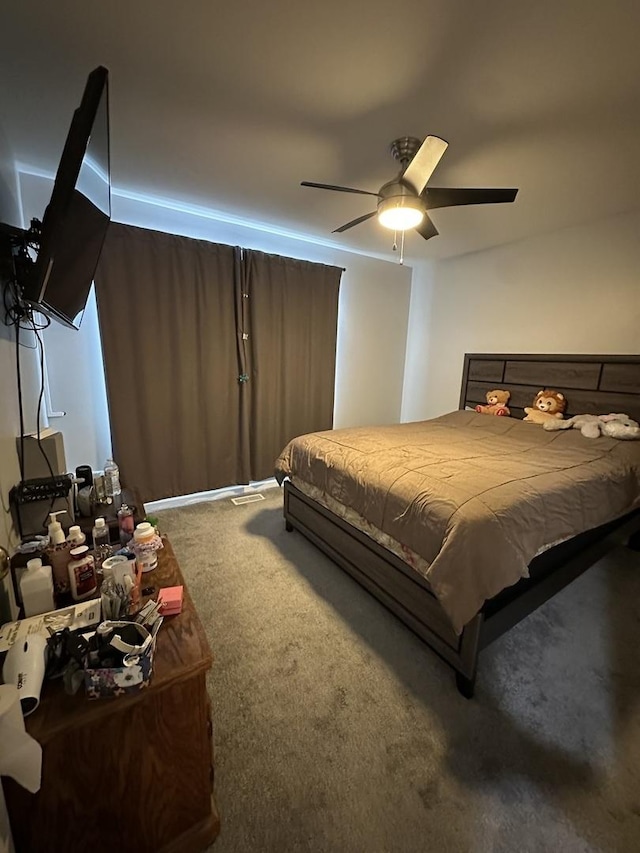 bedroom featuring ceiling fan and carpet floors