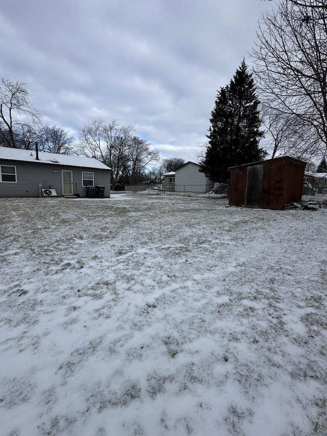 view of yard layered in snow