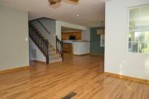 unfurnished living room featuring light hardwood / wood-style flooring