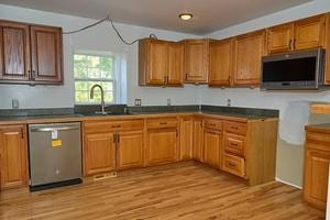 kitchen featuring sink, light hardwood / wood-style floors, and appliances with stainless steel finishes