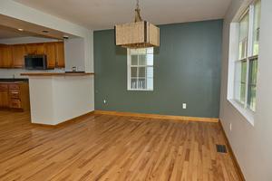 kitchen with pendant lighting and light wood-type flooring