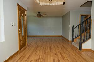 interior space featuring ceiling fan and light wood-type flooring