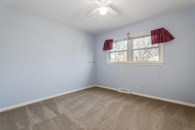 unfurnished room featuring carpet, visible vents, and baseboards