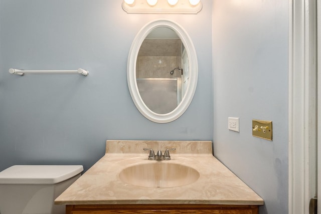 bathroom featuring toilet and vanity