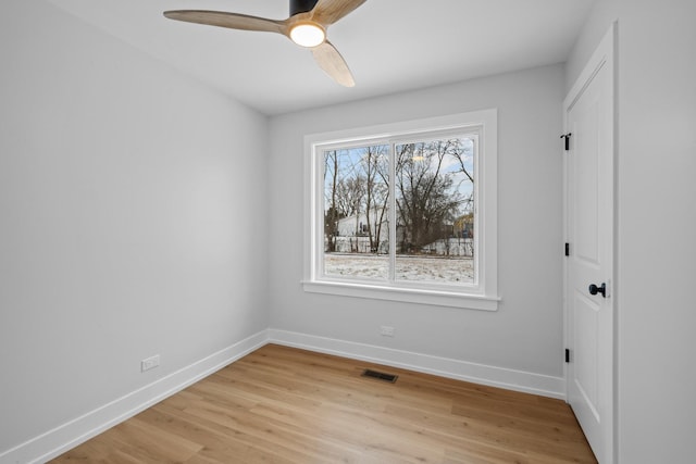 unfurnished room with ceiling fan and light hardwood / wood-style flooring