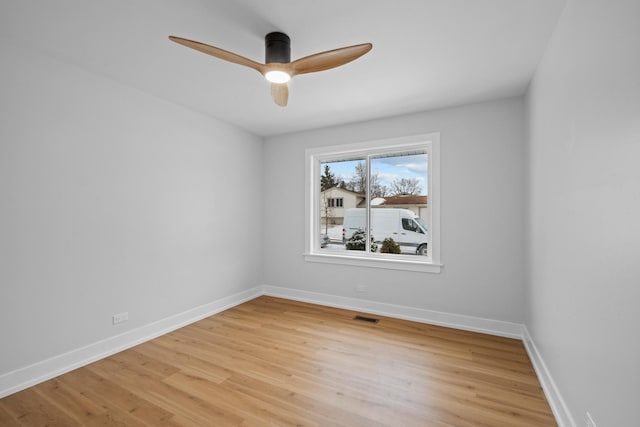 unfurnished room with ceiling fan and light hardwood / wood-style floors